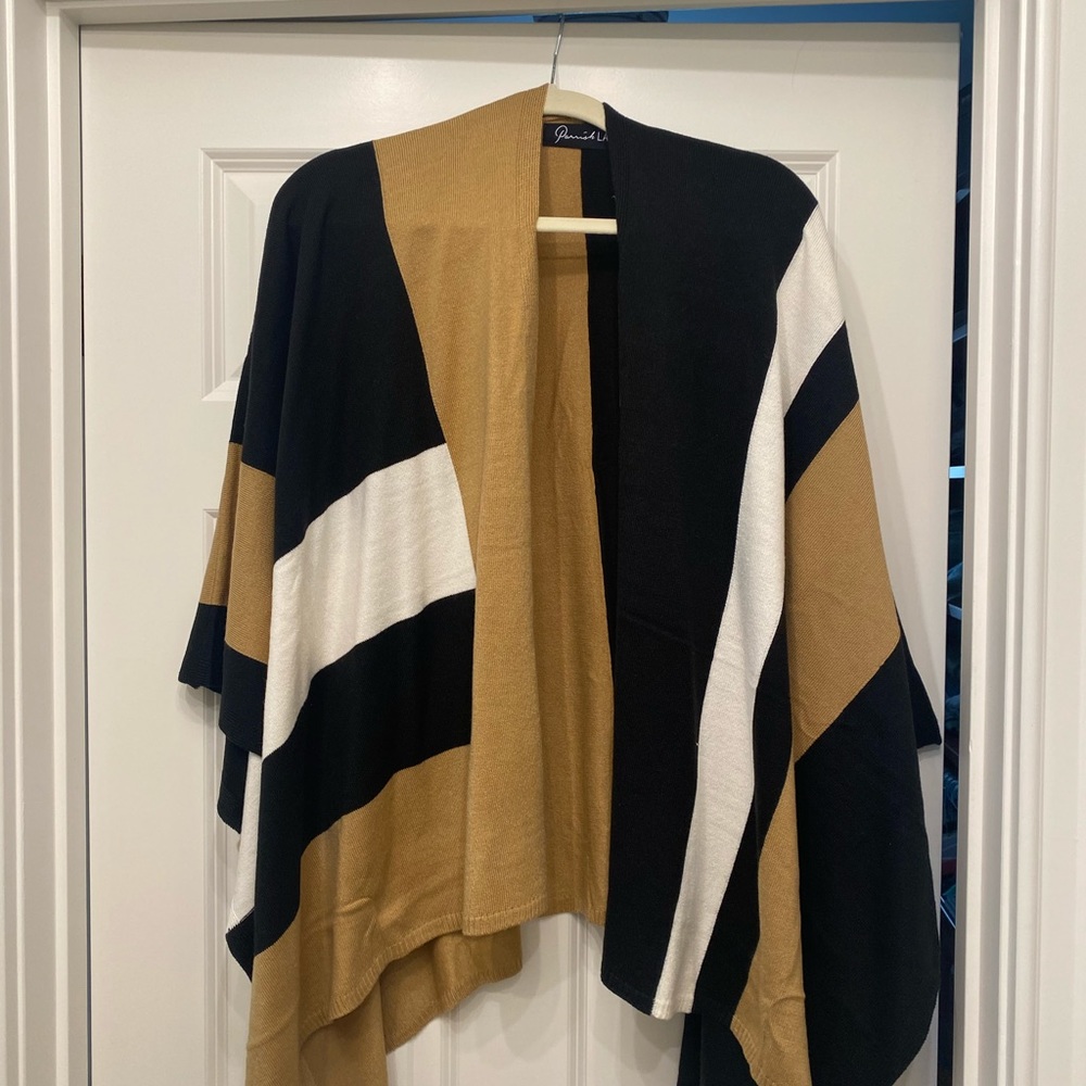 Never been worn black/ivory/brown Poncho. Versatile, soft and brand new!